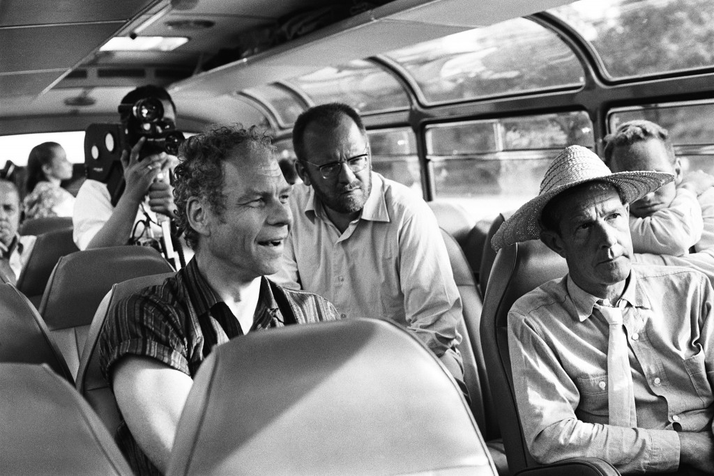 On a cach from Paris to Hamburg for the shooting of Cunningham's Ballet"Variations V", Merce Cunningham, movie maker Klaus Wildenham, John Cage(straw hat), 1966.