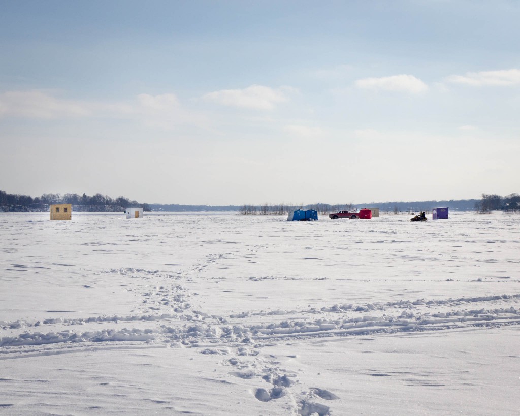 A nearby cluster of icefishing shacks